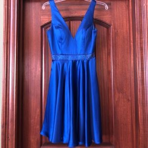 Blue cocktail dress with embellished waistline